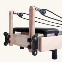 Machine de Pilates Reformer en bois avec design à rail complet et cadre réglable surélevé pour l'entraînement quotidien à domicile ou en studio