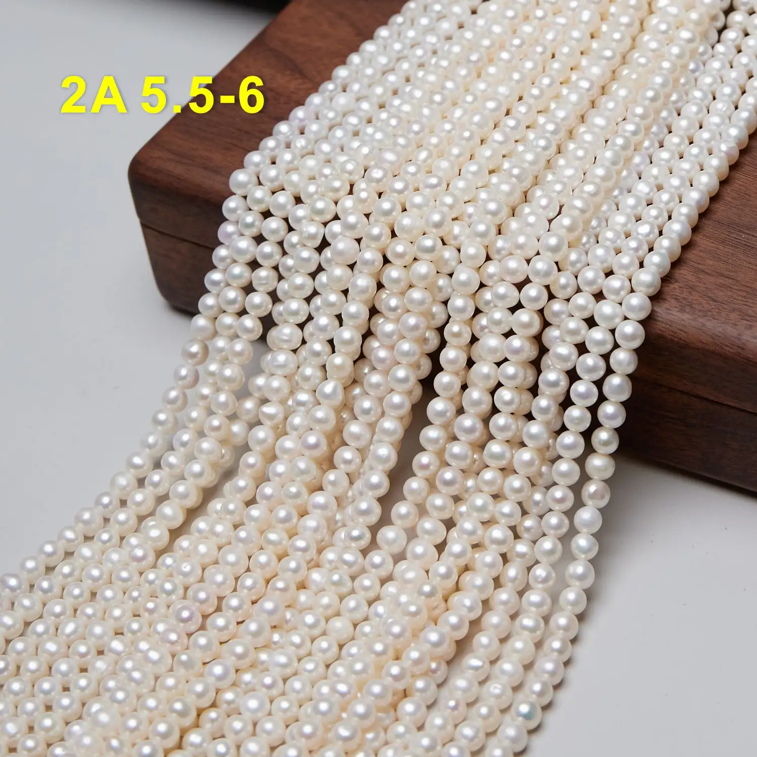 Factory price natural freshwater pearl strand 5.5-6mm 2A natural Near round semi-finished pearl necklace