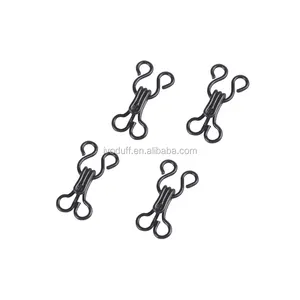 Hooks And Loops For A Bra On A Beige Piece Of Fabric. Metal Fasteners For  Women's Underwear. Accessories For Sewing Bra Loops And Fasteners. Stock  Photo, Picture and Royalty Free Image. Image