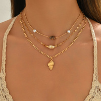 Ensemble de colliers longs à pendentifs multicouches en coquillage et perles dorées, style vacances d'été, minimaliste et luxueux