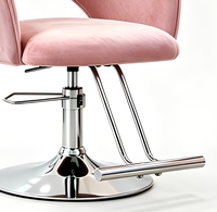Chaise de barbier élégante et luxueuse, réglable en hauteur avec fonction hydraulique et accoudoirs en velours, pour salon de coiffure ou usage domestique.