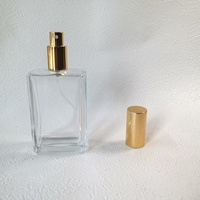 Flacon de parfum portable en verre transparent carré de 100 ml avec pulvérisateur doré/argenté, diffuseur à roseaux sérigraphié pour les déplacements