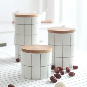 Wholesale custom Nordic large ceramic storage pot kitchen food tea coffee sugar jar with bamboo lid