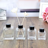 Vente en gros de flacons de parfum vides en verre transparent carrés de 50 ml, 100 ml, 150 ml, 200 ml avec bouchon à vis