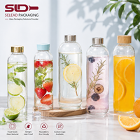 Bouteille d'eau sport en verre borosilicate 500 ml, résistante à la chaleur, avec manchon en silicone, couvercle en bambou, boucle de transport, cadeau d'affaires, vente en gros