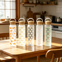 Bouteille en verre écologique de 550 ml avec surface en silicone douce au toucher et design personnalisé imprimé sur toute la surface