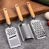 Manche en bois Gadgets de cuisine en acier inoxydable Râpe à fromage et légumes Trancheuse à mandoline sûre