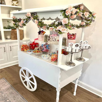Chariot mobile cylindrique 2026 en promotion pour fleurs, bonbons et chocolats, présentoir sur roulettes