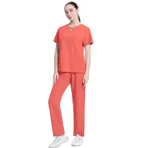 Set di uniformi per lo scrub dell'infermiera del dentista del salone di bellezza della sala operatoria con scollo a v di moda all'ingrosso