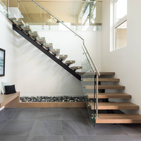 Escalier flottant en acier et bois avec garde-corps en verre pour escalier intérieur moderne invisible à monopoutre