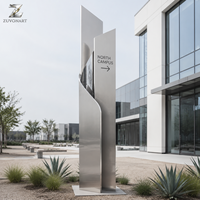 Colonne de signalisation sculptée autoportante en acier inoxydable, finition brossée, pour hôtels, centres commerciaux, aéroports et halls d'entreprises modernes