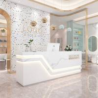 Mobilier luxueux pour salon de beauté et de coiffure en marbre blanc Bureau de réception moderne multifonction avec rangement