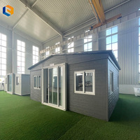 Maison conteneur moderne pliable à double aile extensible, étanche et isolée, préfabriquée pour projets de camping et d'hébergement
