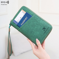 Portefeuille de voyage minimaliste et élégant avec blocage RFID pour passeport et cartes de crédit, avec rangement pour billets de voyage et cartes de visite (matériau PU)