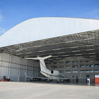 Hangar d'avion en structure acier sur mesure avec portes coulissantes pour le stockage de jets privés dans les immeubles de bureaux et les centres commerciaux
