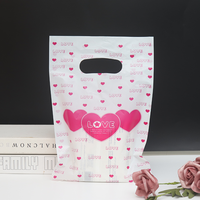 Sacs à provisions en plastique avec impression de logo personnalisé emballage de sac en PE découpé cadeau de Noël prêt en stock pour le magasin de détail