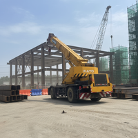 Grue sur camion KATO RT d'occasion de 50 tonnes, fabrication japonaise, avec direction à 4 roues, hauteur de levage de 25 m, moteur Mitsubishi, pour travaux de construction lourds