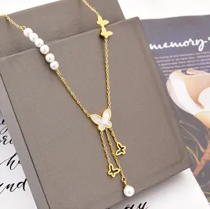 Vendita all'ingrosso delle coperture della perla della collana del pendente-Versione coreana di collana di perle bianche conchiglia farfalla collana in acciaio al titanio cava lunga nappa pendente per le donne