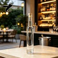 Bouteille de whisky en verre premium de 200 ml, base lourde de 420 g, fermeture en liège, 60 pièces par carton, idéale pour les spiritueux, les cadeaux, les distilleries.