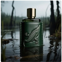 Bouteille de parfum de luxe pour hommes et femmes conteneur en cuir rechargeable en relief avec capuchon en or emballage cadeau de surface sérigraphiée