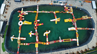 Parc aquatique gonflable flottant Fun Wolong avec parcours d'obstacles et trampoline pour la mer et le lac