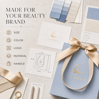 Sacs shopping en papier blanc de luxe personnalisés avec poignées en ruban longues pour l'emballage de marques de cosmétiques et de produits de beauté, vente en gros