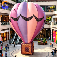 Modèle de montgolfière gonflable géante personnalisée et colorée avec panier pour décoration suspendue au plafond de centre commercial, événements et fêtes