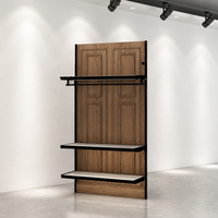 Portant à vêtements en MDF grain chêne avec cadre métallique noir, barre de suspension, 3 étagères blanches et tiroir inférieur, vente en gros CE