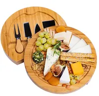Ensemble de planches à charcuterie rondes en bambou écologiques avec couteau à fromage en acier inoxydable et épandeur à beurre pour une utilisation culinaire gastronomique