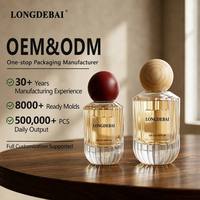 Venta al por mayor en stock: Botella de perfume de vidrio transparente con rayas verticales cilíndricas de 30ml, 50ml, 100ml, botella de perfume vacía con tapa de bola de madera.
