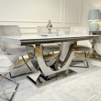 Ensemble de table à manger moderne de luxe avec plateau en marbre et base en acier inoxydable doré, chaises de salle à manger en velours pour la maison, l'hôtel ou la villa