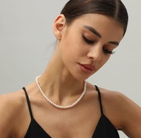 Collier de perles de perles naturelles presque rondes de culture d'eau douce de 6 à 7mm à lustre élevé avec fermoir mousqueton en argent et chaîne d'extension