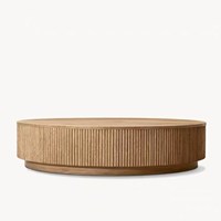 Table basse ronde RH MULHOLLAND PLINTH en bois massif avec piédestal cannelé, design moderne et minimaliste pour salon