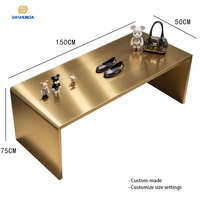 Table de présentation de luxe en acier inoxydable recyclable pour îlot d'exposition, idéale pour vêtements, chaussures, sacs en magasin de détail