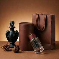 Flacon de parfum en verre cylindrique rond de luxe, personnalisable avec logo, 50 ml, rechargeable, avec vaporisateur, vente en gros OEM