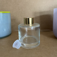 Aromathérapie en verre transparent classique pour bouteille de diffuseur de roseau 50ml/100ml rond vide plat avec bouchon de logo personnalisé et Bo