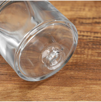 Flacon de parfum de luxe en verre transparent de 50 ml, base épaisse cylindrique, vide, avec atomiseur à sertir de 15 mm et capuchon sphérique argenté mat brillant