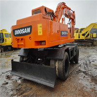 Excavatrice sur pneus Doosan Dh130 d'occasion Excavatrices sur pneus Doosan 130 140 d'occasion à vendre