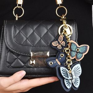 Llavero de mariposa de cuero PU al por mayor con temática de insectos para mujer, dijes para bolso - Product Image 2
