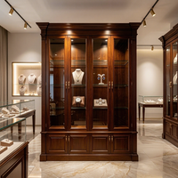 Vitrine de présentation de bijoux en bois sculpté de style européen, comptoir d'îlot incurvé pour les bijouteries haut de gamme en or et en jade