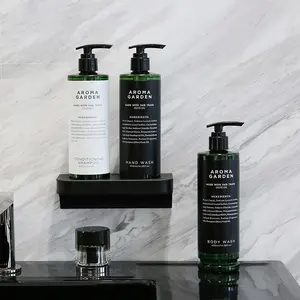 Double distributeur manuel en plastique magnétique de savon de shampooing de 400ml fixé au mur en plastique d'ABS d'hôtel ressource