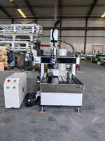 Nouvelle machine de gravure et de fraisage CNC multifonctionnelle de bureau 6090 à 4 axes avec changement automatique d'outils pour cylindres plats
