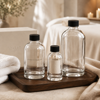 Bouteilles en verre rondes transparentes personnalisées avec bouchons à vis pour huile de massage, soins corporels et emballage cadeau spa