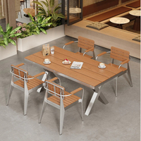 Mobilier d'extérieur pour la restauration : Table et chaises de salle à manger en acier inoxydable pour terrasse, idéal pour les projets commerciaux de cafés et la vente en gros.