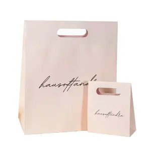 Bolsas de compras de papel con logotipo impreso personalizado para embalaje, bolsas de papel de ropa de regalo de lujo