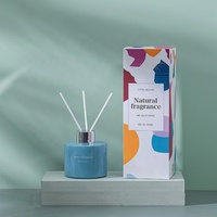 Aromathérapie de parfum d'huile essentielle colorée personnalisée ronde de 120ml pour la bouteille de diffuseur de roseau avec le bouchon à vis emballé dans une boîte