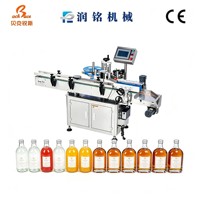 Machine d'étiquetage entièrement automatique à alimentation par rouleaux pour les bouteilles de jus de fruits, d'eau minérale et de gin