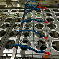 Machine d'emballage sous vide et de scellage pour barquettes alimentaires à grande capacité de production, utilisée en usine, pour plats prêts à consommer