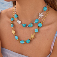 Collier en acier inoxydable plaqué or 18 carats et argent avec perles de turquoise, breloques étoile de mer et conque, idéal pour l'été, pour femme