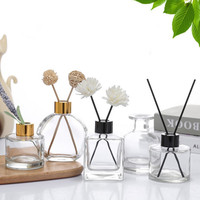 Vente en gros de flacons de parfum vides en verre transparent carrés de 50 ml, 100 ml, 150 ml, 200 ml avec bouchon à vis